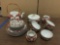 20 piece unmarked china tea service set with gold accents. Some missing lids.