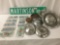 11 license plates and 11 vintage hub caps, incl. Ford, Chevy, and more, approx. 22x16x16 inches.