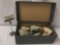 Box full of eight pairs of baby shoes and one pair of slightly larger black shoes, approx. 14x7.5x5