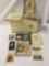Wood box full of antique and vintage photographs, storybooks, and maps, approx. 20x12.5x12 inches.