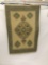 Hanging Eastern rug with geometric and floral pattern