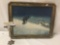 Vintage print of wolf in the snow in wood frame.