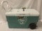 Coleman Unltimate Xtreme 50 qt cooler with four cup holders, wheels, drain, and 72 cans of beer