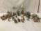 Over 25 porcelain and ceramic Christmas miniatures/ornaments. Approx. 15x11x8 inches.