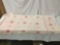 Pink vintage soft fabric blanket with simplistic floral pattern and fringe, approx. 80x50 inches.