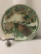 Vintage Asian ceramic plate depicting colorful peacock scene, approx. 12x12x2 inches....