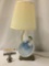 Vintage lamp w/ blue dancer figure on base, tested and working, approx. 8x7x17 inches.