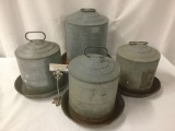 Four vintage metal feeders, some rust and wear, largest approx. 16x16x16 inches.