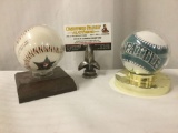 Two baseballs w/ stands, incl. 1993 All-Star Game Commemorative baseball and a Seattle Mariners