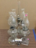 Collection of five antique and vintage glass oil lamps. One by White Flame Light Co