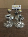 Two pairs of weighted sterling silver candle holders. garden silversmiths and more.