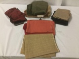 Ten pieces of upholstery bits and fabrics, approx. 15x15x12 inches.