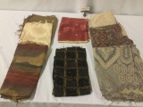 Eight pieces of soft and coarse colorful fabric and remnants. Approx. 15x19x5 inches. JRL