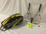 Babolat tennis bag w/ Penn balls & a pair of Babolat tennis rackets, approx. 30x13x12 inches.