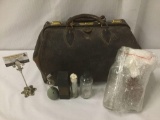 Vintage leather bag filled with vintage glass pieces, some wear, see pics, approx. 12x21x12 inches.