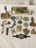 Miscellaneous metal and composite ornamental items, incl. badges, pins, beads, and more. Approx.