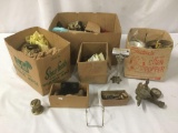 Four boxes full of misc hardware, incl. knobs, hinges, outlet panels, and more. Approx. 17x12x18