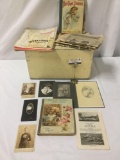 Wood box full of antique and vintage photographs, storybooks, and maps, approx. 20x12.5x12 inches.