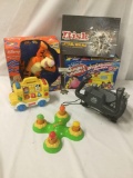 Six toys/games, incl. CH Products Flight Sim Yoke, Risk, Tigger Toy, and more. Approx. 16x10x6