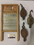 Dubi Handi washboard and three vintage pulley hooks, approx. 9x19x1 inches.