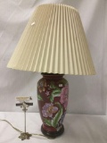 Red floral ceramic lamp w/tan shade, tested and working, approx. 18x18x29 inches.