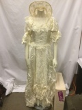 White Alfred Angelo Tina Michele wedding dress and veiled bridal hat, approx. 14x48 inches.