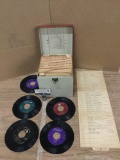 Collection of over 70 vinyl 45rpm records. They come in a metal case