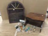 Collection of 17 glass, plastic, and stone animal figurines with a curio case and stand.