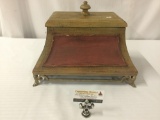 Decorative Asian style small wood chest on metal legs with lid, approx 17x13x13 inches.
