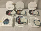 Five Marilyn Monroe commemorative plates with COAs and one glass wolf piece, approx. 9x9x14 inches.
