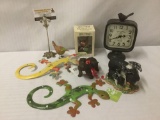 6 animal ornaments and one HD Designs bird clock, approx. 14x9x5 inches.