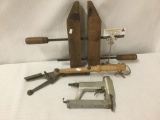 Three vintage tools, incl. a Senco nail gun, a clamp, and a clay pigeon thrower (?), approx. 22x13x3