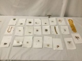 23 pieces of costume jewelry, approx. 9x6x3 inches.