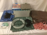 Five tarps and five lengths of rope and wire, approx. 24x17x13 inches.