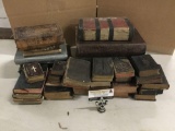 Large collection of antique and vintage bibles and religious texts.