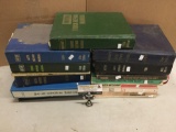 Collection of 16 vintage auto repair manuals. Largest measures approx 12x10x2 inches.