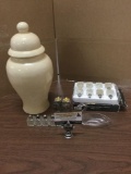 Collection of home decor items. Silverplate salt and pepper shakers, glass swan, and ceramic jar.