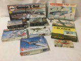 Ten used plane, boat, and artillery model kits, incl. Azimut, MPC, Hasegawa, and more, approx.
