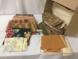 Big lot of colorful remnants, upholstery bits, and misc. fabrics, approx. 15x19x14 inches.
