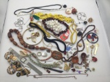 Large collection of costume jewelry. Shells, watch, hand painted and more.