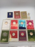 Collection of 11 Franklin Mint holiday and religious coins. Christmas and Hanukkah.
