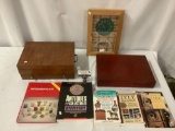 Lot of 8: 2x vintage flatware storage boxes, Boundary Waters Trading Post clock, 7x collectors books