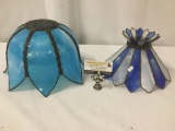 Two blue composite hanging lamp shades, approx. 20.5x13x12 inches.