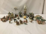 Over 25 porcelain and ceramic Christmas miniatures/ornaments. Approx. 15x11x8 inches.