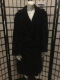 Black coarse faux-fur coat with soft fabric lining, approx. 18x38 inches.