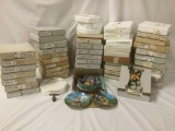Over fifty boxes filled with collectors plates, incl. W.L.George China, M.J.Hummel, the Bradford