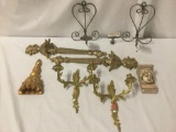 Nine pieces of regal metal, composite, and wood, candelabras, candle holders, and sconces, approx.