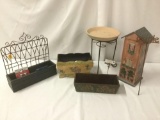 Six lawn ornaments, planters, shelves, and a flower pot stand, approx. 13x13x17 inches.