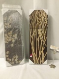 Pair of engraved three dimensional wood art pieces, approx. 25x8.5x2.5 inches.