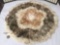 Circular rug made of a collage of different furs - fox, small mammal, etc